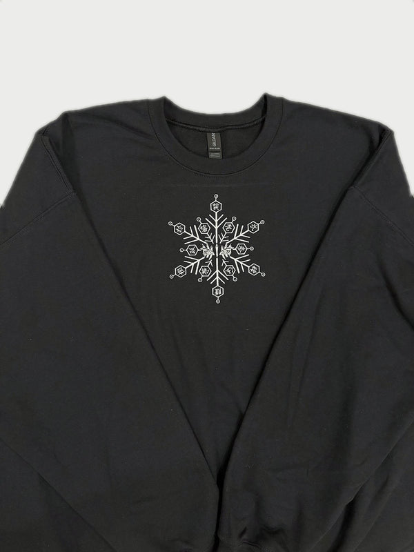 Snowflake embroidered on a black crewneck, made by NF Studio